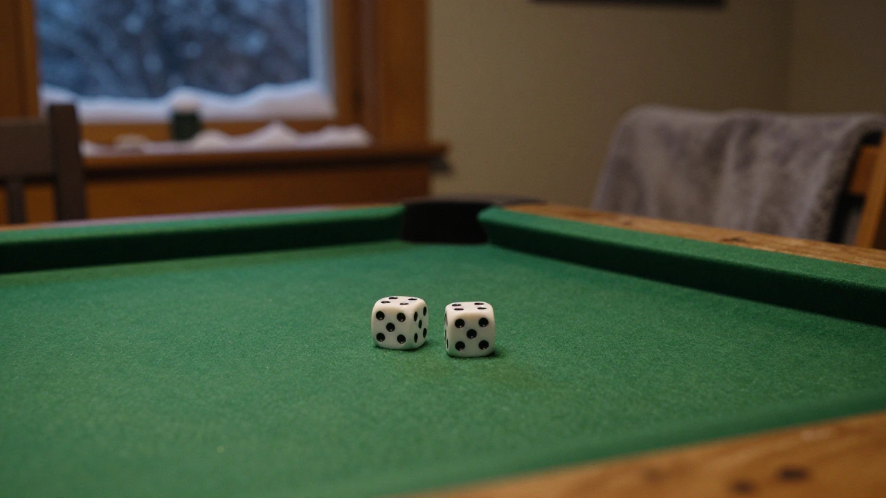 Two white dice on green felt in a basement game room for table games